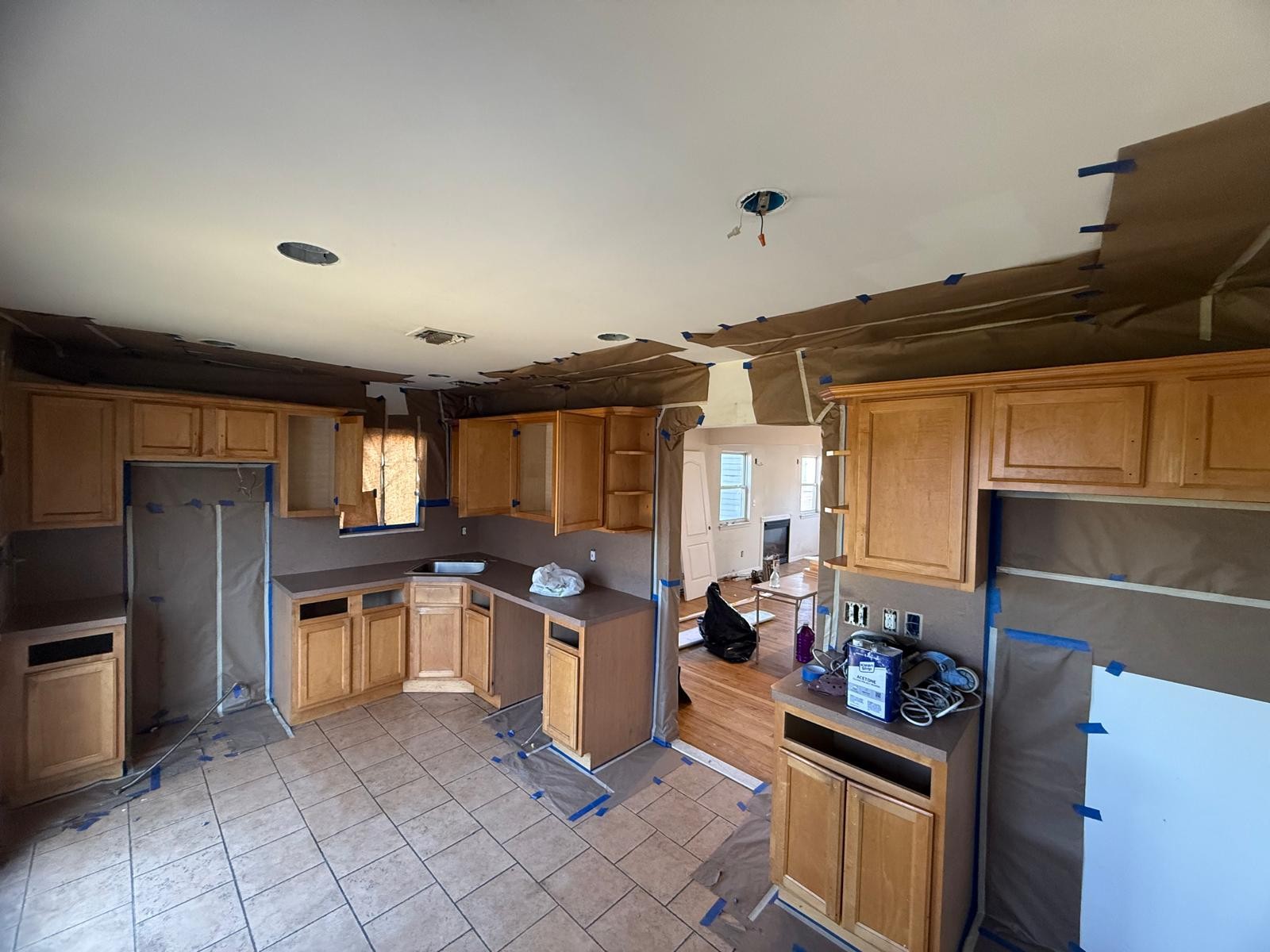 Kitchen before remodeling - old oak cabinets under renovation